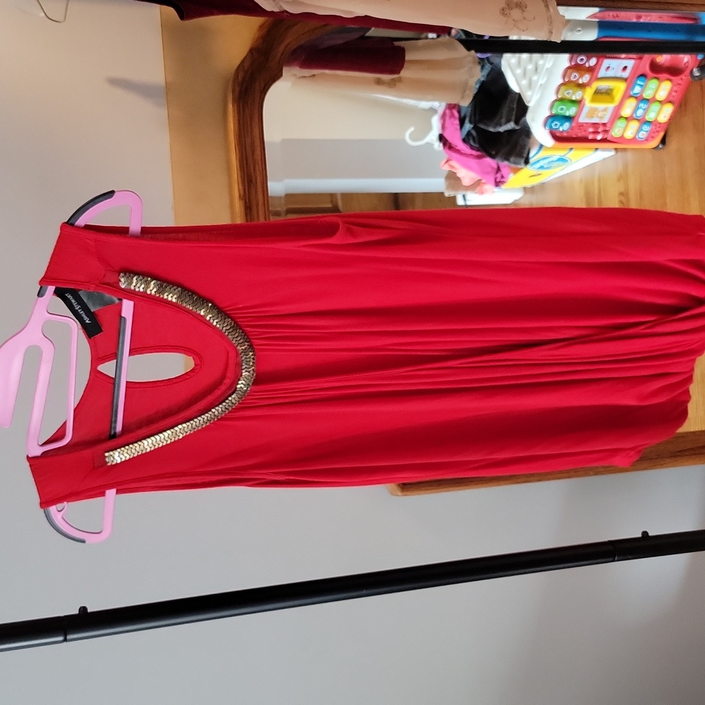 16. Red top with brass trim and crossover front with key hole back